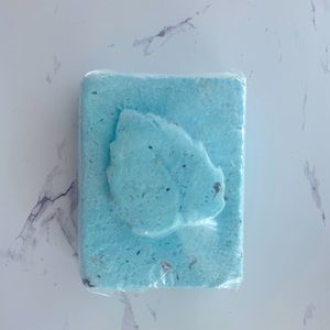 One large handmade all natural blue grapefruit bath bomb.